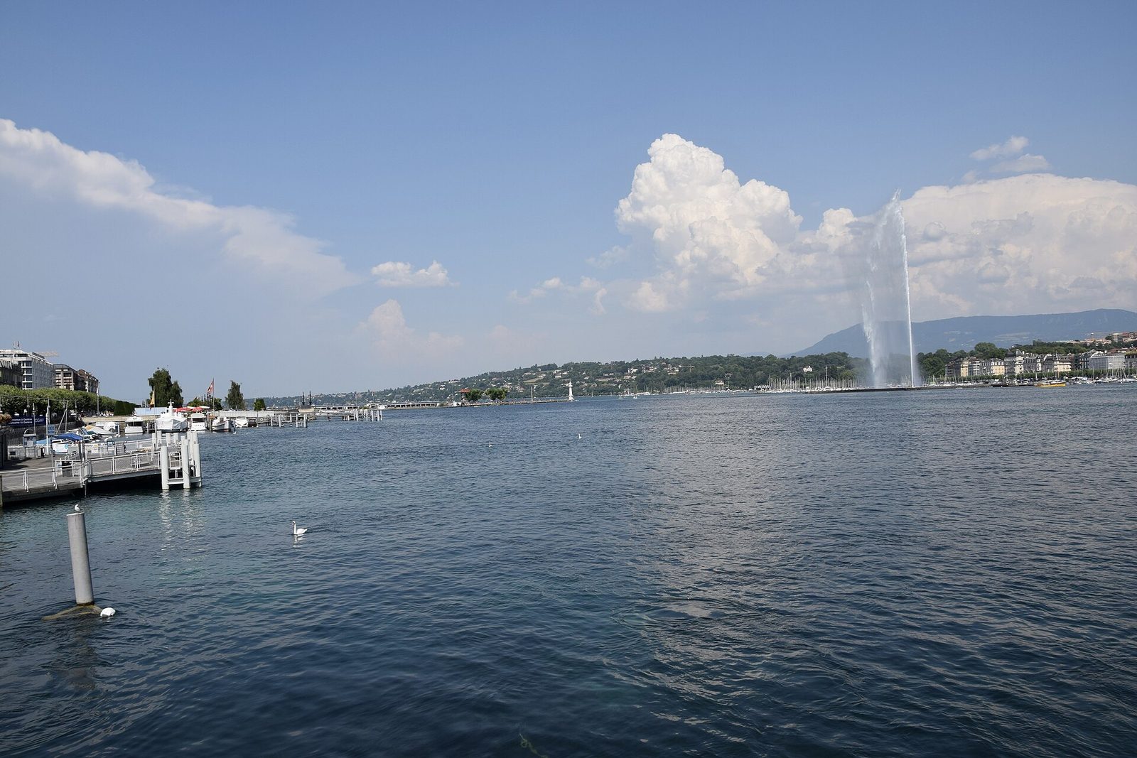Geneva's Jet d'Eau fountain on Lake Geneva, the Alps beyond.