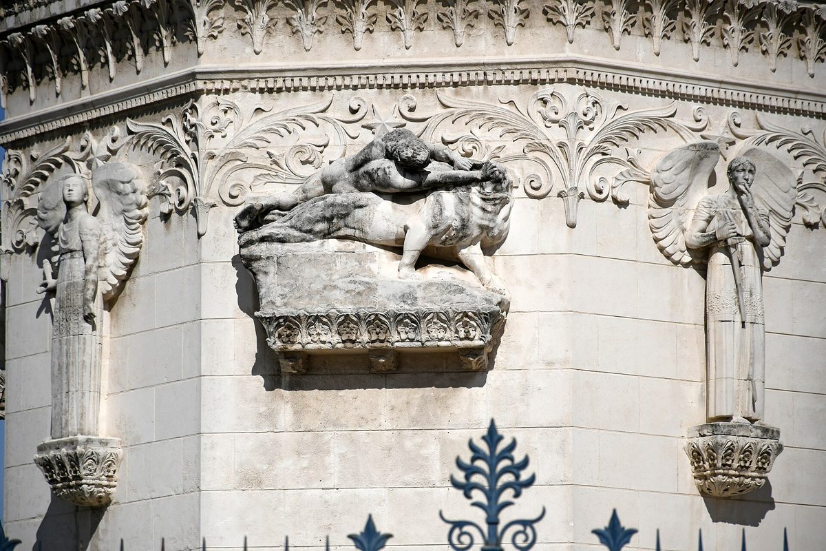 A carved detail on the façade of the Fourvière basilica.