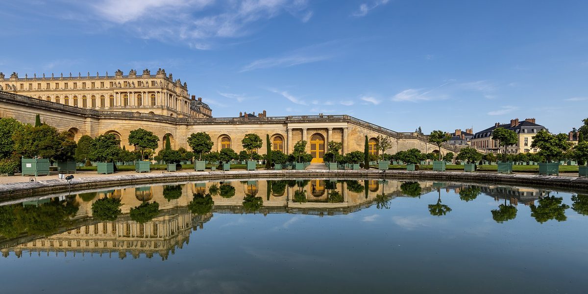 The Orangerie gardens and the Palace of Versailles.