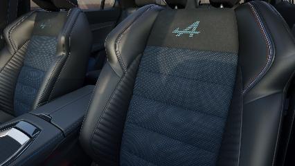 Gros plan des sièges avant Esprit Alpine du Renault Austral avec logo Alpine brodé et surpiqûres bleues