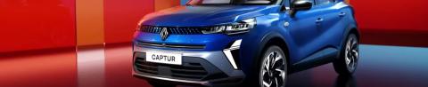 Renault Captur front three-quarter studio shot in blue, showing the LED C-shape light signature and the front grille